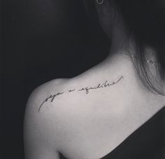 a woman's upper back shoulder tattoo with the words love and happiness written in cursive font