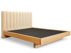 a wooden bed frame with an upholstered headboard