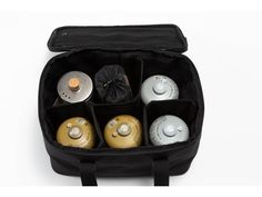 a black case filled with lots of different types of bottles in it's compartments