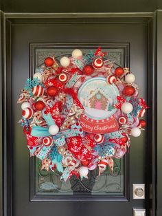 a christmas wreath is hanging on the front door