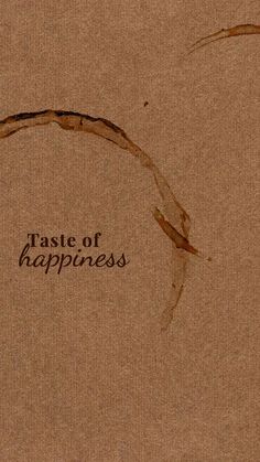 the words taste of happiness written in brown ink on top of a piece of cardboard