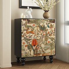 an ornate cabinet with flowers and birds on it in front of a wall mounted radiator