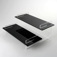 an acrylic table with two shelves on each side