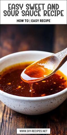 a white bowl filled with sauce on top of a wooden table next to a spoon