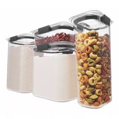 three containers filled with cereal and nuts next to each other