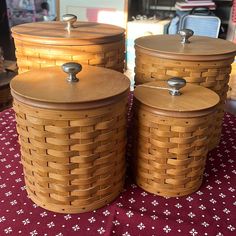 three wooden baskets sitting on top of a table