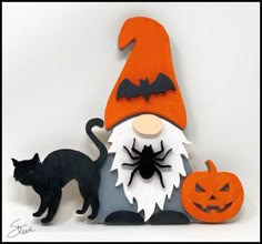 an image of a halloween scene with a cat and gnome