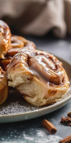 cinnamon rolls with icing on a plate