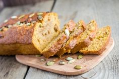 sliced loaf of bread sitting on top of a wooden cutting board