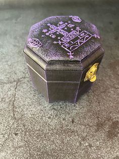 a small black box sitting on top of a floor