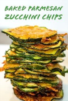 baked parmesan zucchini chips stacked on top of each other