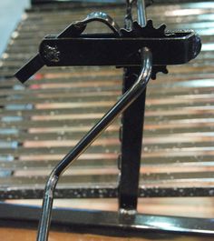 a metal object sitting on top of a wooden table