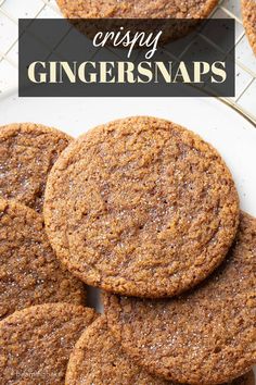 crispy ginger snaps on a white plate with text overlay that says crispy ginger snaps