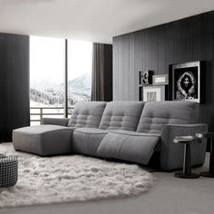 a living room filled with furniture and a rug on top of a carpeted floor