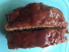 two pieces of meatloaf on a blue plate