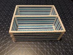 a blue and white basket sitting on top of a table