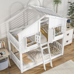 there is a bunk bed with stairs to the top and bottom floor, next to a desk