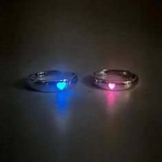 INCLUDES: (1) Pair Glow in the Dark Adjustable Matching Rings for Couples - or - (1) Glow in the Dark Adjustable Matching Rings for Couples SPECIFICATIONS: Metal: Zinc Alloy Color: Silver Size: About 1.8 cm inner diameter before adjustment (opening adjustable) DESCRIPTION: Ignite the magic of your connection with these Glow in the Dark Adjustable Matching Rings for Couples. Crafted with love and luminosity, these rings offer a unique and enchanting way to symbolize your bond. Made from high-qual Couple Rings Silver, خواتم خطوبة, Dark Rings, Light Jewelry, Ring Man, Heart Fashion, Versatile Jewelry, Adjustable Jewelry, Couple Jewelry