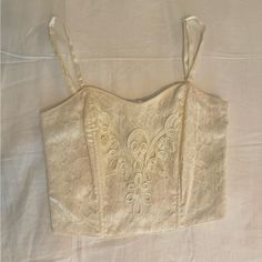 Vintage Victoria’s Secret Bustier Corset Top With Tags Still On! Beautiful Wedding Like Lace And Bead Detail In Perfect Condition, Never Worn. The Back Has Clasps And Consists Of A Stretchy Material Offering Flexibility. The Straps Are Adjustable. As This Is Vintage, The Tags Say Medium/Large For Sizing But I Recommend This For A Size Small. Lace Bustier, Sleeveless Hoodie, Cami Crop Top, Long Sleeve Knit Tops, Short Sleeve Bodysuit, Cream Lace, Tank Top Hoodie, T Shirt And Shorts, Red Blouses