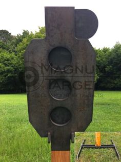 an old traffic light sitting in the middle of a field