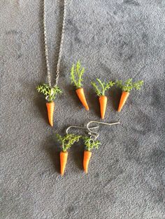 (19,642) Carrot Necklace and Earrings  Polymer Clay and plastic, about 1" x 1/4" (impossible to make two exactly the same) Earrings on rhodium ear wires  Necklace on 16" rhodium chain with 2" stainless extender Carrot Necklace, Earrings Polymer, Wire Necklace, Earrings Polymer Clay, Jewellery Sets, Necklace And Earrings, Ear Wires, Favorite Jewelry, Jewelry Sets