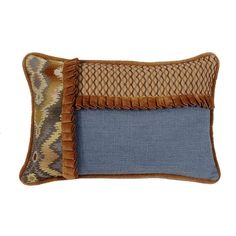 a blue and brown pillow with fringes on the front, sitting against a white background