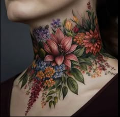 a woman's neck with flowers painted on it