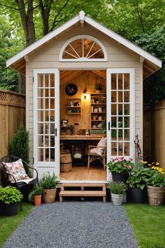 a small garden shed with lots of potted plants