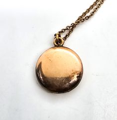 Gold filled etched locket mid century photo necklace. Good used condition with little to no signs of normal wear. Chain has early thumb clasp. Etched with the number 16 on the inside of each side of locket. Comes with vintage picture and frame. Necklace measures 15.5 inches long. Locket measures 5/8ths of an inch across. Cameo Medallion Necklace For Keepsake, Cameo Medallion Locket Necklace Keepsake, Cameo Medallion Locket Necklace For Keepsake, Antique Gold Necklace With Vintage Charm For Keepsake, Keepsake Medallion Locket Necklace With Cameo, Cameo Medallion Locket Necklace, Antique Gold Medallion Necklace For Keepsakes, Brass Medallion Locket Necklace With Cameo, Antique Pendant Locket Necklace With Vintage Charm