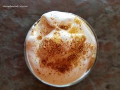 an overhead view of a drink with cinnamon sprinkles