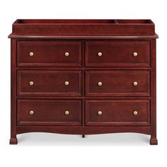 a wooden dresser with many drawers and brass knobs on the top drawer, against a white background