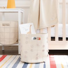 a baby's room with a crib and toys in it