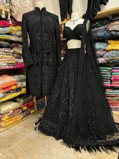 Luxury Black Lehenga For Reception, Luxury Traditional Black Wear For Reception, Luxury Black Sequined Lehenga, Luxury Black Choli For Reception, Luxury Black Lehenga For Traditional Ceremonies, Luxury Black Lehenga For Celebration, Luxury Black Chinon Lehenga, Luxury Black Festive Choli, Luxury Glamorous Black Lehenga