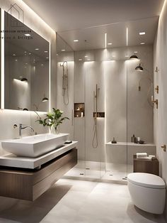 a bathroom with a toilet, sink and shower in it's center wall is illuminated by recessed lighting