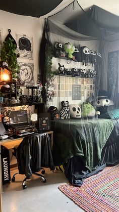 a bedroom decorated in black and white with lots of halloween decorations