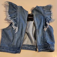 Girl's Denim Sleeveless Jacket.. Forever 21. New With Tags. Size Small But Fits Any Teenager. 1 Large Zipper In Front. Stylish! Trendy Cropped Medium Wash Vest, Trendy Cropped Vest In Medium Wash, Trendy Medium Wash Cropped Vest, Trendy Cropped Blue Vest, Girls Black Jacket, Pleather Jacket, Jean Jacket For Girls, Girls Denim Jacket, Blue Jean Outfits