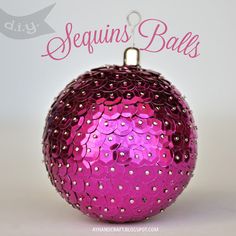 an ornament with pink and gold sequins is shown in the center