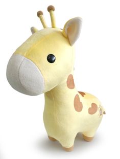 a stuffed giraffe is shown on a white background