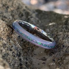 Stunning 4mm wide DiamondCast™ Unicorn poop with opal inlay. This wedding band is custom-made for you right here in the USA by skilled artisans who have an uncompromising passion for quality and style. The finish on this ring is polished with a rounded profile. *4mm DiamondCast™ Unicorn Poop with opal inlay *Available in sizes 4-15.5 in whole, half, and quarter size increments *Handcrafted by Skilled Artisans SKU: COB-4F-DC UP-11G-PURP OPAL About DiamondCast: DiamondCast™ Blanks are made with a