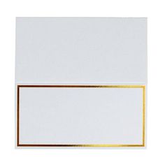 an empty white card with gold foil on the edge and a blank paper in the middle