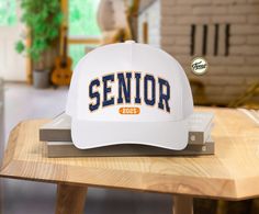 Senior 2025 Distressed Trucker Hat, Graduation 2025 Cap Hat, Varsity Senior Hat, Graduation Class Of 2025 Senior Hat, Trendy School Hat We are here to offer you the best hat options which are perfect as a gift for you or your friend! These hats are the perfect addition to your everyday wardrobe. They can be paired with your workout fit for a morning walk or cozy sweatshirts while running errands. PRODUCT  **   65/35 polyester/cotton  **   Multicam is 60/39/1 cotton/polyester/PU spandex  **   Str Blank Hats, Class Of 2025, Display Pictures, Workout Fits, Morning Walk, Cozy Sweatshirts, Everyday Wardrobe, Picture Display, Text Color