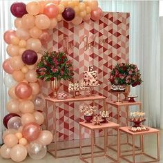 an image of a party with balloons on the wall and tables full of desserts