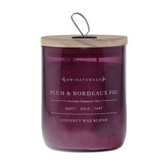 plum and bordeauux fig candle in a glass jar with a wooden lid