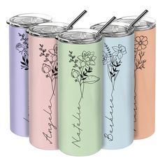 four different colored tumblers with flowers and names on them, each one has a straw in it