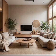 a living room filled with lots of furniture and a flat screen tv mounted on the wall