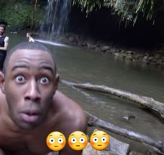 a man is making faces in the water with three other people behind him and one has his eyes wide open