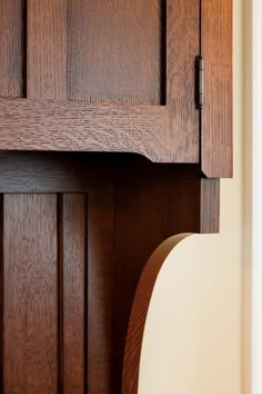 a close up view of a wooden cabinet door