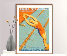 a poster is hanging on the wall next to a vase