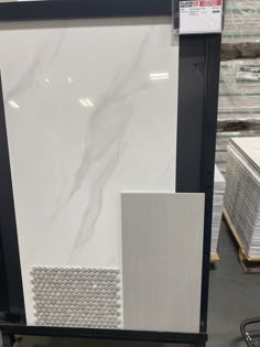 a large white marble display case in a store