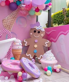 an ice cream parlor decorated with balloons and decorations